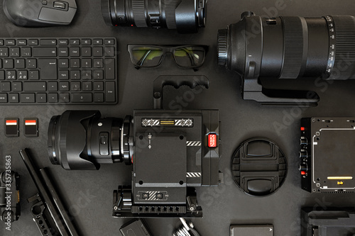 Top View of a Creative Filmmakers Office Desk with Lined up Camera and Gear photo