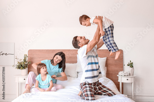 Happy family having fun in ...