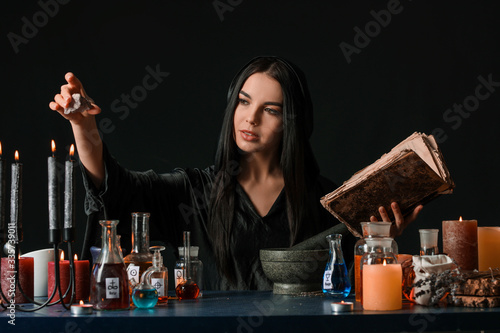 Female alchemist making pot...