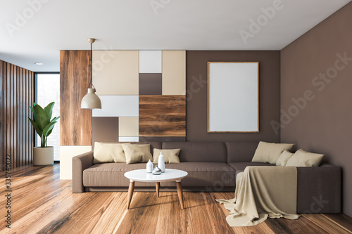 Gray living room interior, brown sofa and poster
