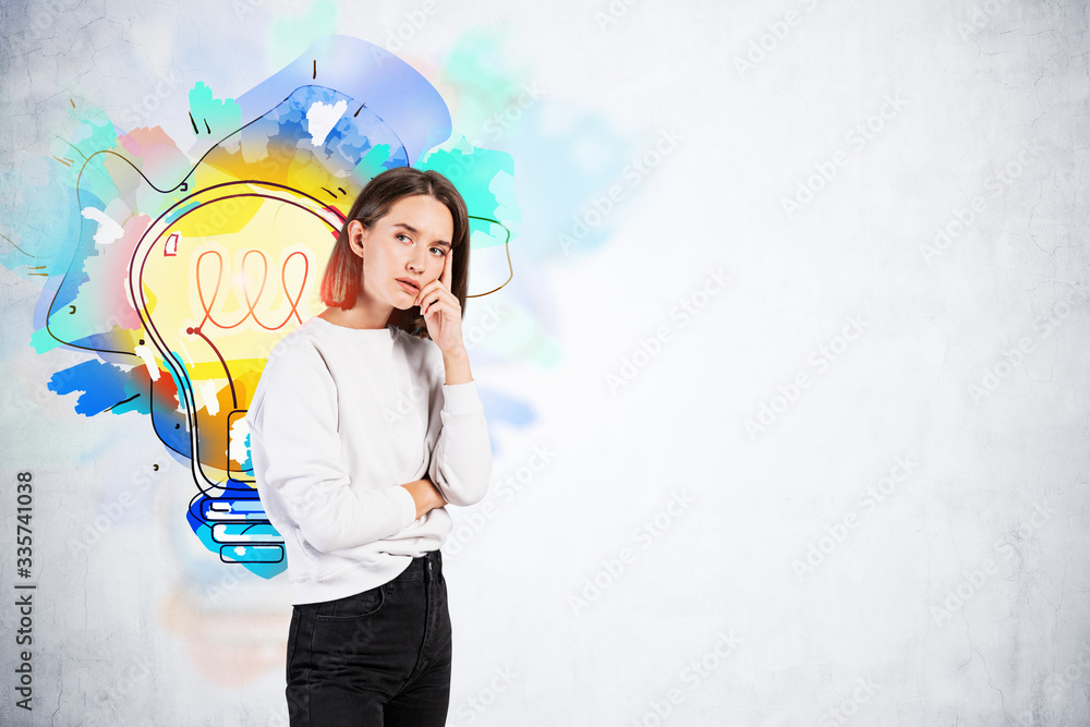 Thoughtful young woman and her bright idea Thoughtful young woman and her bright idea