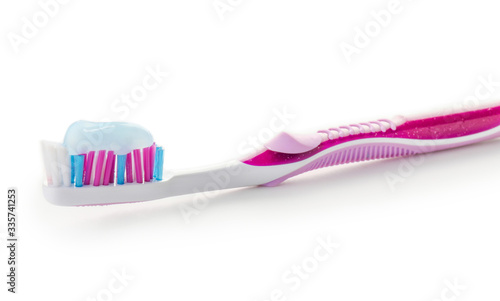 Tooth brush with paste on white background