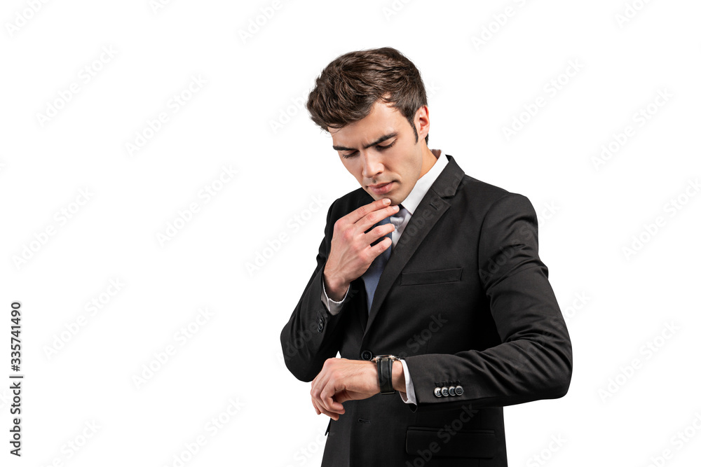 Thoughtful businessman looking at watch, isolated Thoughtful businessman looking at watch, isolated