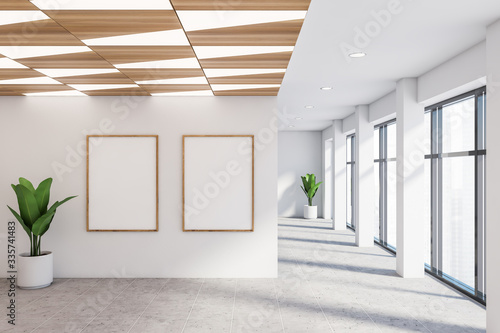 Empty white office hall with posters photo