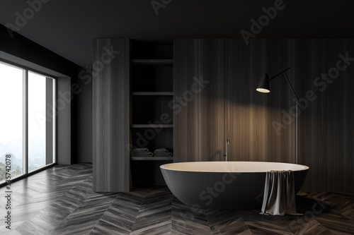 Dark wooden bathroom interior with tub