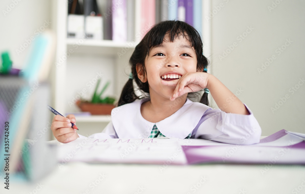 Happy genius student kid girl enjoy learning at school. Intelligence, Homework, studying and Education concept. Happy genius student kid girl enjoy learning at school. Intelligence, Homework, studying and Education concept.