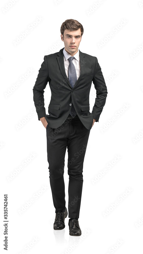 Serious European businessman walking forward Serious European businessman walking forward