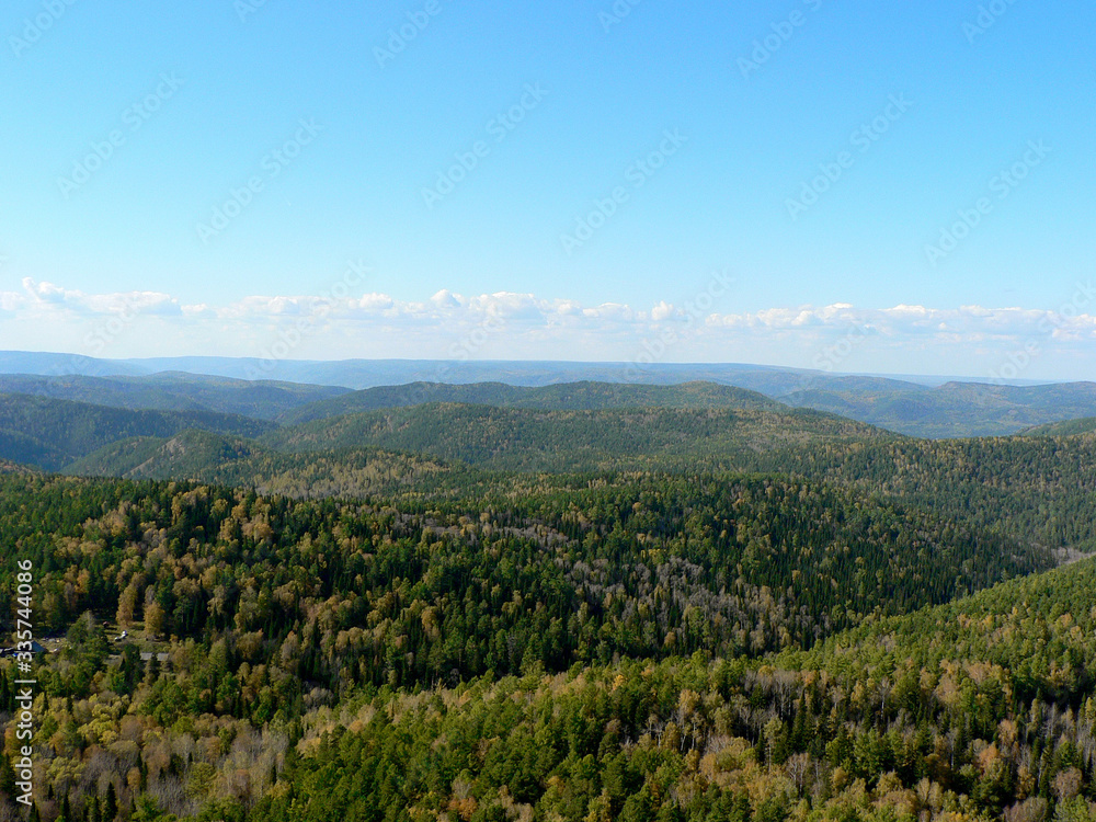 Mountains covered with forest in autumn