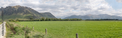 Castle Hill and Trotters Plain in green countryside, near Fairlight, New Zealand photo