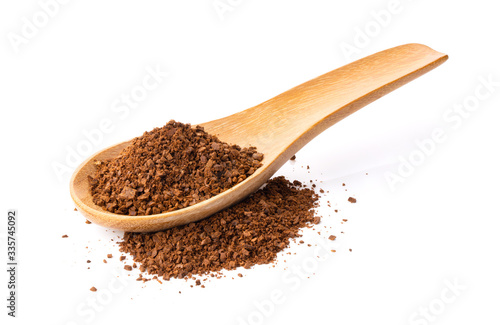 coffee powder in wood spoon on white background