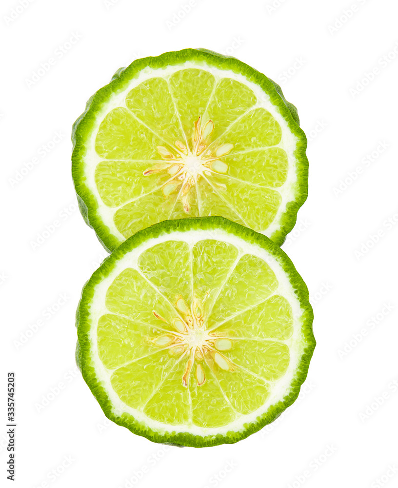 A half of bergamot or kaffir with seeds on white background A half of bergamot or kaffir with seeds on white background
