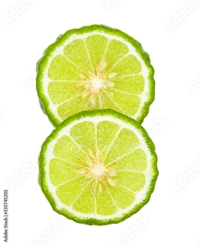 A half of bergamot or kaffir with seeds on white background