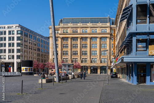 FRANKFURT AM MAIN, GERMANY SEPTEMBER 13, 2019: pedestrians in front of office building and skyscraper on the imperial square frankfurt am main germany photo