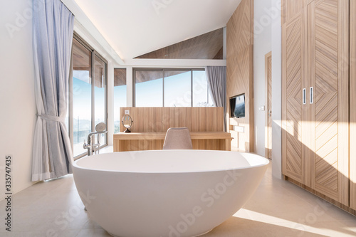 Interior design of round bathtub in modern bathroom of pool villa  house  home  condo and apartment