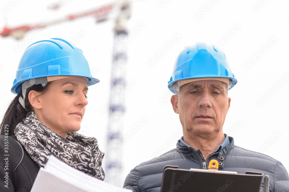 Construction manager and architect on a buildding site Construction manager and architect on a buildding site