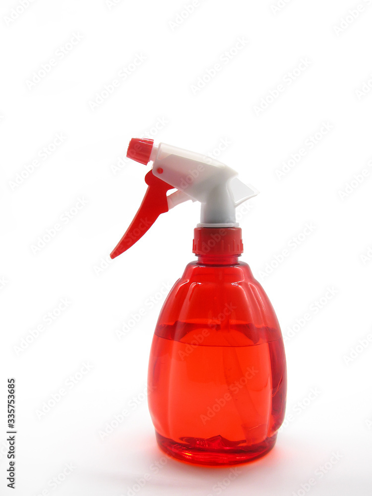 red spray bottle with liquid on a white background red spray bottle with liquid on a white background