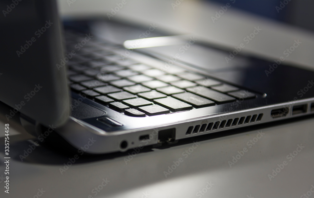 laptop for office work. Black computer for business on a white table laptop for office work. Black computer for business on a white table