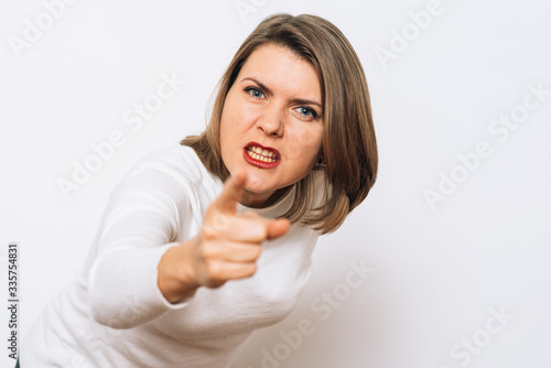 Wallpaper Mural studio portrait of a beautiful girl pointing to the camera Torontodigital.ca