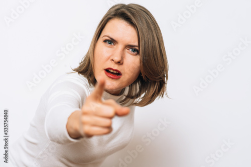 Wallpaper Mural studio portrait of a beautiful girl pointing to the camera Torontodigital.ca