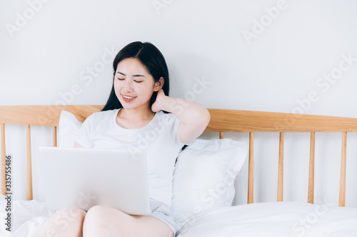 Asian young women use laptops at home