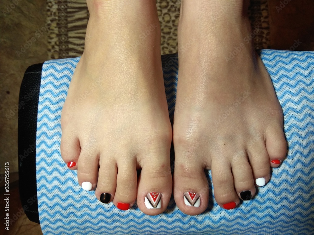 Fototapeta premium The manicurist excellently made her work a beautiful manicure with a polish gel on her hands and the client is happy 