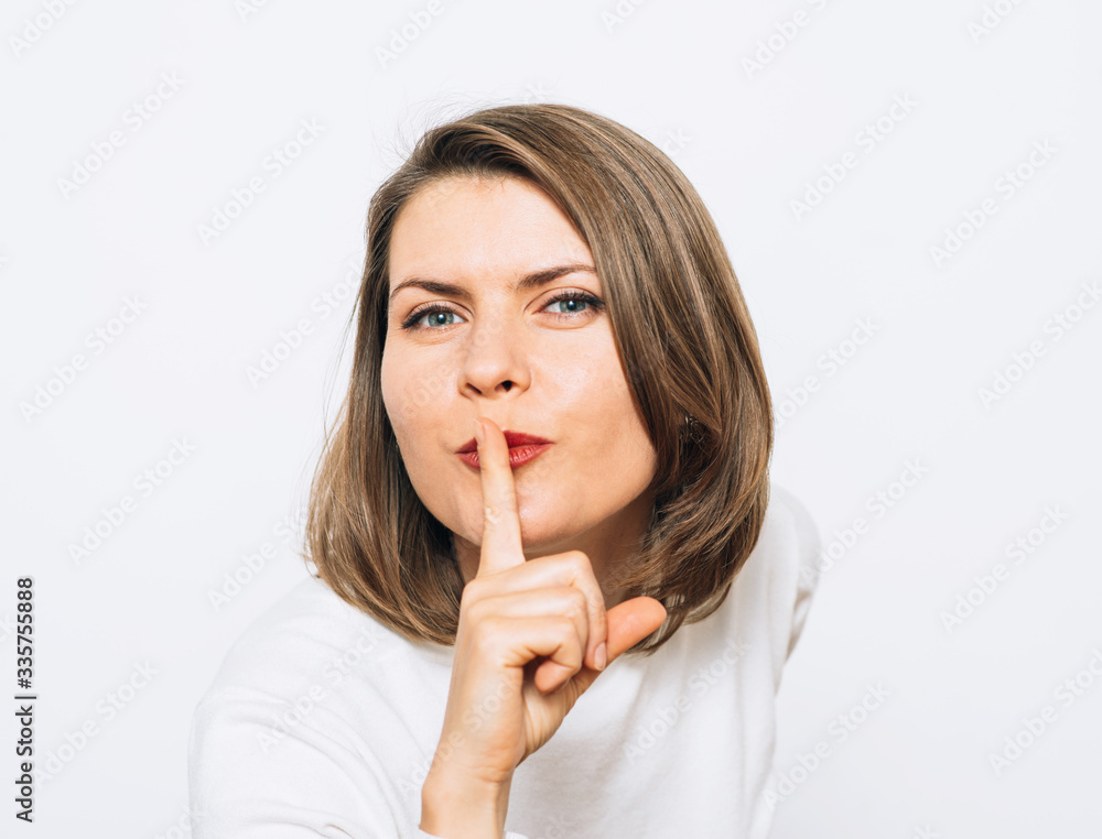 woman put finger on her lips woman put finger on her lips