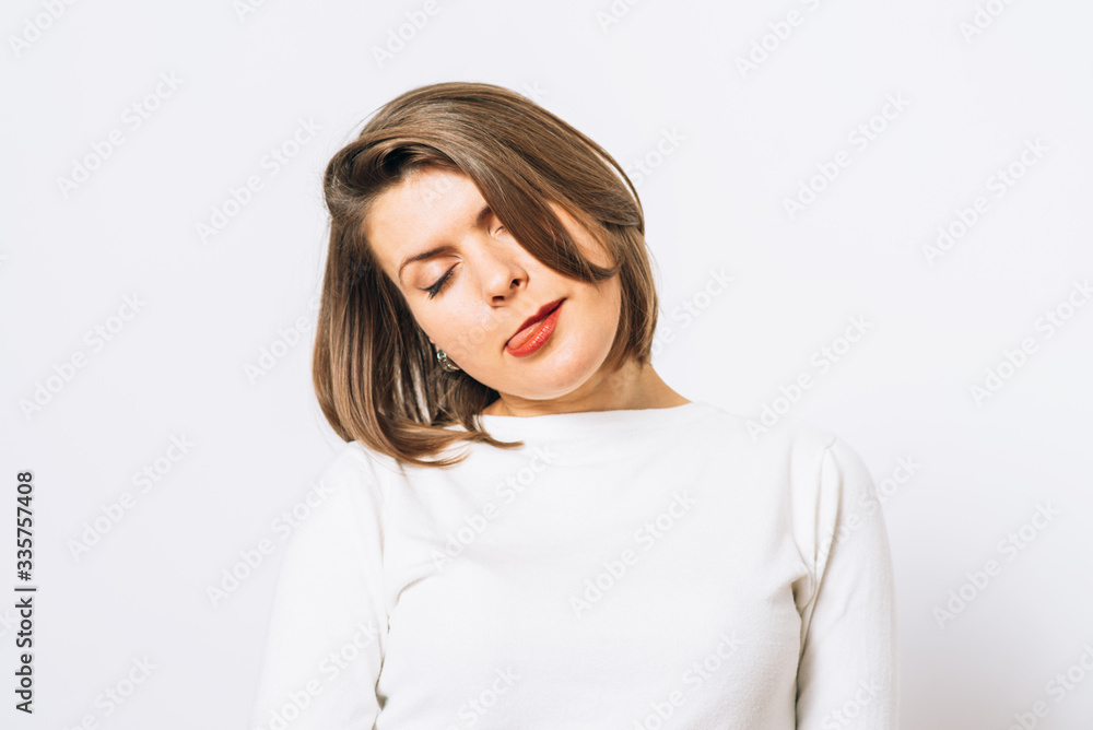 fatigue of a young girl in a photo studio. Pain, depression, fatigue. fatigue of a young girl in a photo studio. Pain, depression, fatigue.