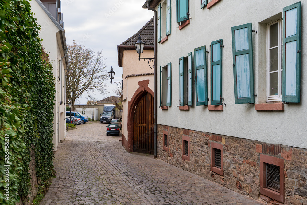 03.04.2020. Town Aschaffenburg, northwest Bavaria, Germany. Street with colorful houses of the old city at summer day. Tourist attraction. Concept of travel, tourism