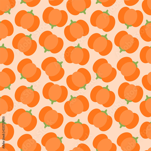 Vegetable pattern. Seamless pattern of pumpkins drawn in flat style on a light orange background. Vector 8 EPS.