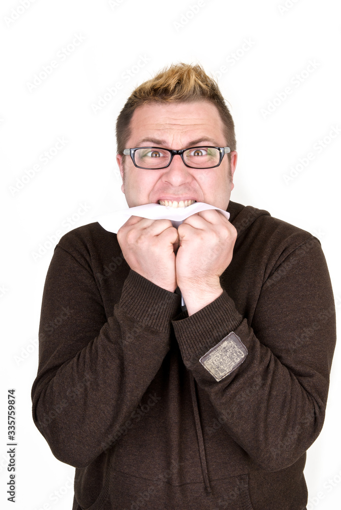 Shocked man eating a document