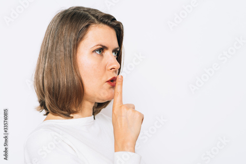 woman put finger on her lips
