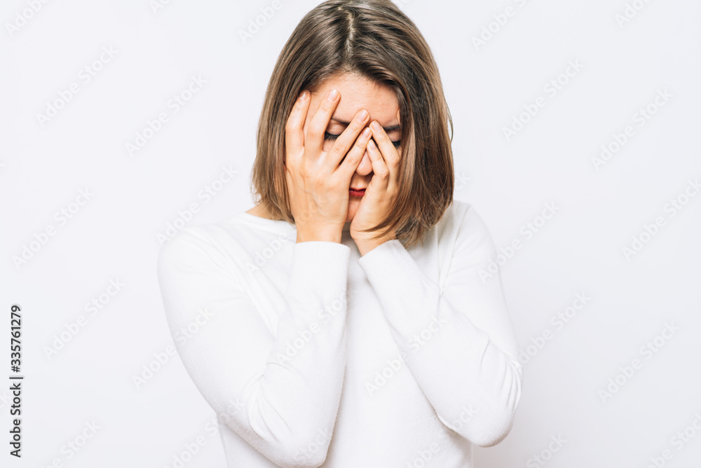 Woman covers his face by hand Woman covers his face by hand