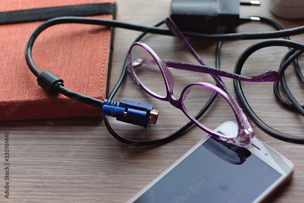 eyeglasses among various items on the table eyeglasses among various items on the table