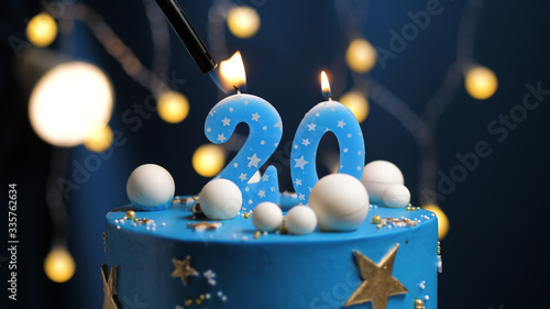 Konstfotografi Birthday cake number 20 stars sky and moon concept, blue candle is fire by lighter