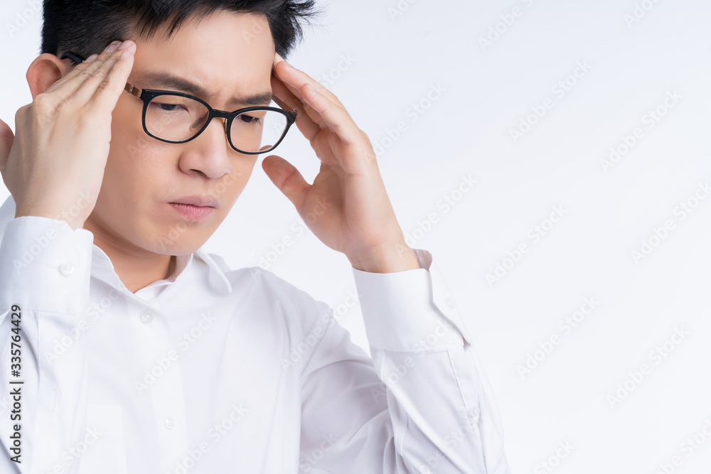 sick asian glasses male adult Headaches & Migraines hand touch head with stressful and tension white background health ideas concept sick asian glasses male adult Headaches & Migraines hand touch head with stressful and tension white background health ideas concept