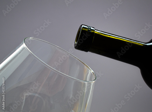 wine and part of a glass on a white background