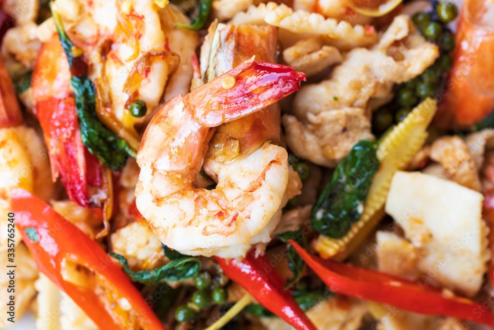 Selective focus of fried stir spicy sea food, Pad Cha Talay Sea Food, Thai food. Close up Selective focus of fried stir spicy sea food, Pad Cha Talay Sea Food, Thai food. Close up