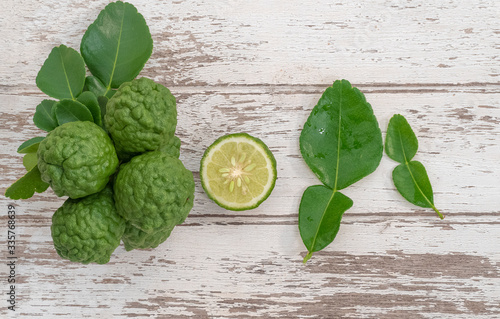 Fresh bergamot from nature Resting on a wooden plank To be used as a cook and nourish the skin. photo