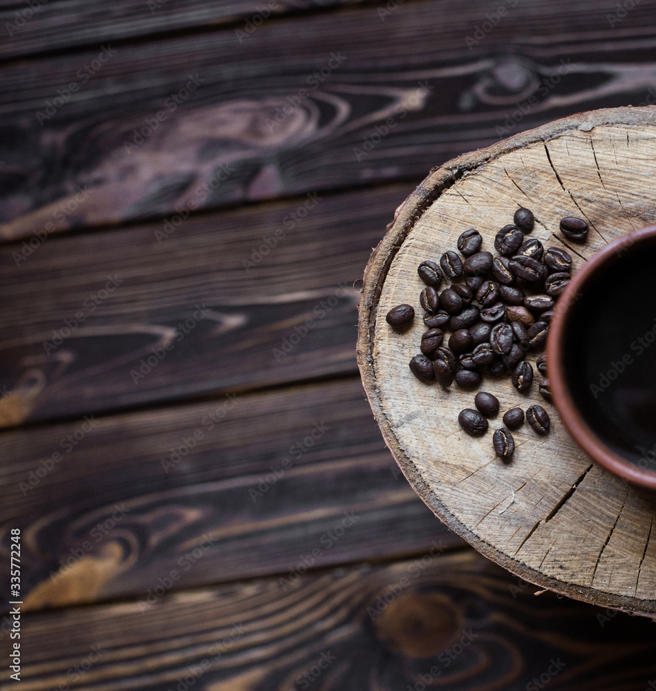 cup of coffee on a wooden background. Coffee, spoon, grain, wooden background. cup of coffee on a wooden background. Coffee, spoon, grain, wooden background.