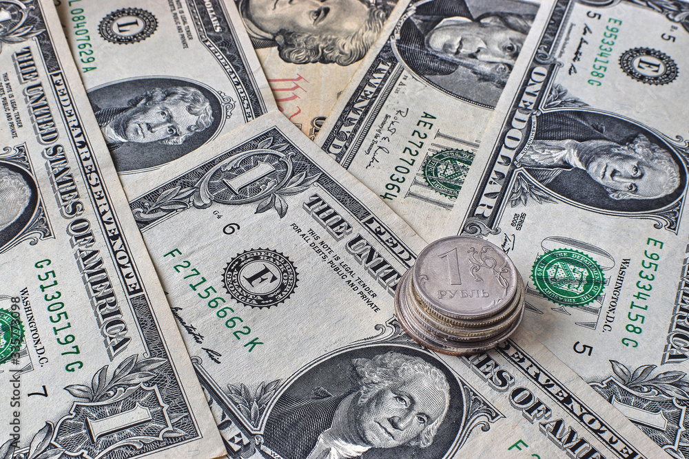 coin ruble on the background bills dollar. coin ruble on the background bills dollar.