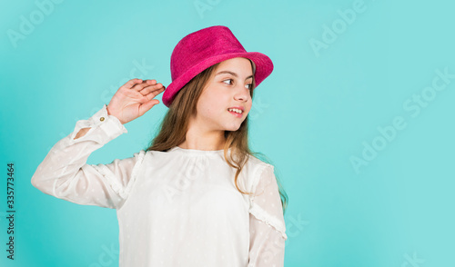 Summer accessory collection. Happy kid in hat. Fashion accessory. Child wear hat. Accessories shop. Protect scalp sun rays. Fancy girl. Spring outfit. Individual style. Girl wear hat blue background