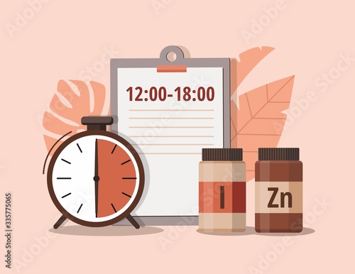 Iodine, zinc and alarm clock. Time of pill. Health care, pharmacy, medicine concept . 