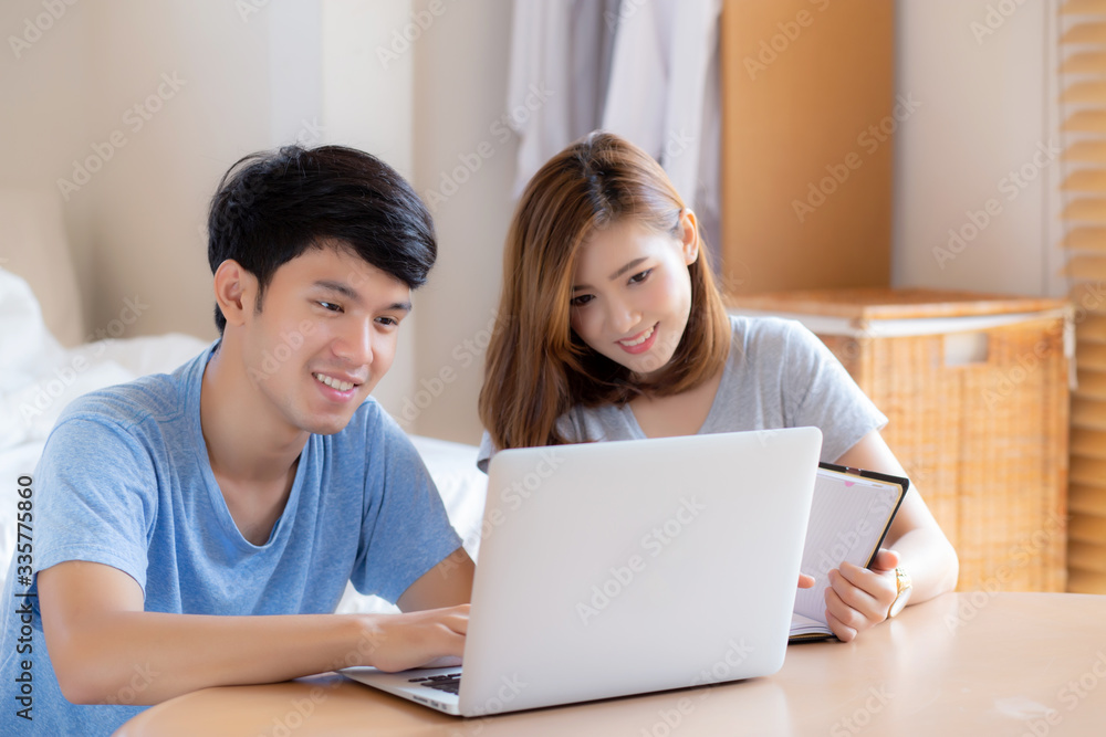 Beautiful asian couple calculate expenses finance with laptop and planning together, woman writing notebook or note budget household, lifestyle family and business concept. Beautiful asian couple calculate expenses finance with laptop and planning together, woman writing notebook or note budget household, lifestyle family and business concept.