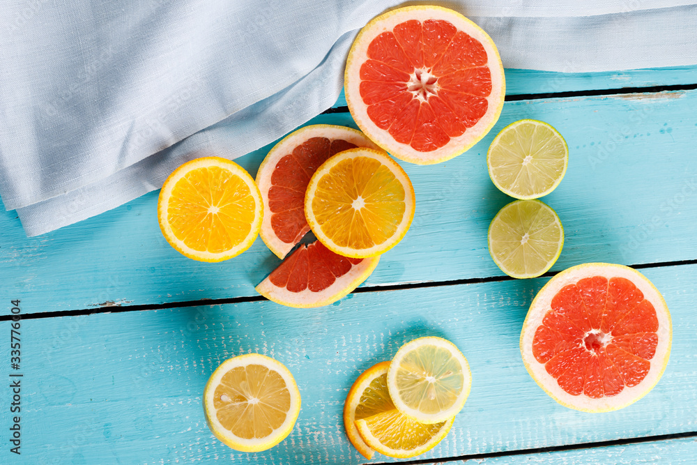 Citrus fruits against a blue wooden table