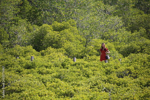 A woman standing at Tung Prong Thong at Rayong  Thailand