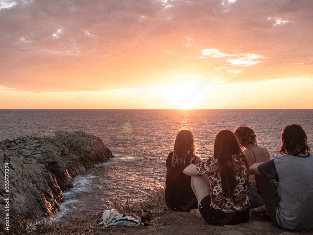 Group of friends watching a sunset at the mexican coast. Group of friends watching a sunset at the mexican coast.