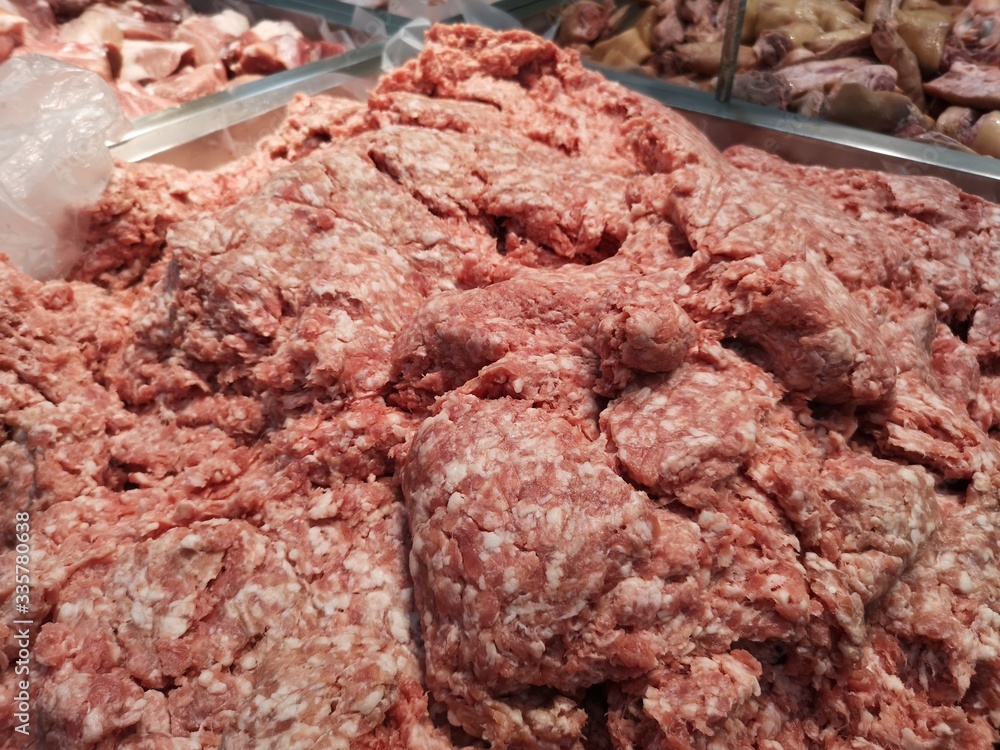 Ground pork on a stainless steel tray in supermarket Ground pork on a stainless steel tray in supermarket