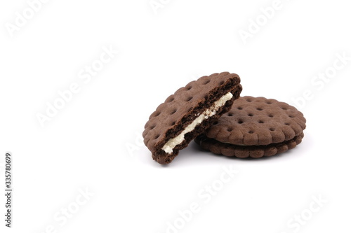 chocolate cream sandwich cookies with cream filling on a white background