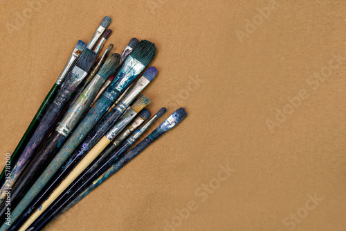 flat lay of Colorful paint brushes. Art concept. Painting process. Hobby to learn at home.