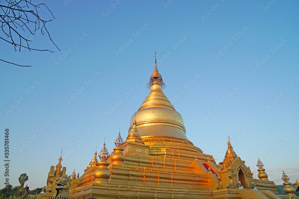 Fototapeta premium Landscape Landmark Ancient golden pagoda at Kuthodaw Pagoda is a famous Buddhist stupa, located in Mandalay, Burma (Myanmar)